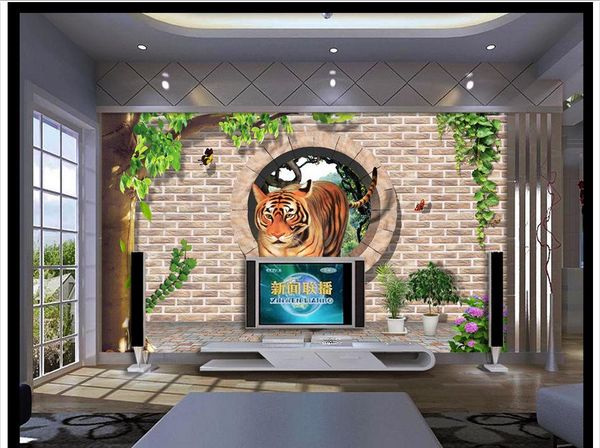 3D custom photo mural wallpaper featuring a 3D brick wall design with a residual wall and round hole, depicting a tiger descending a mountain, ideal for TV background walls