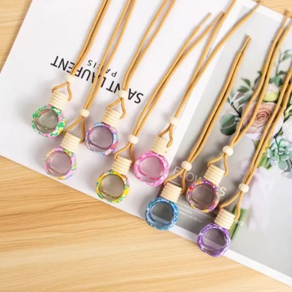 Car perfume pendant for essential oils, a glass bottle air freshener ornament available wholesale