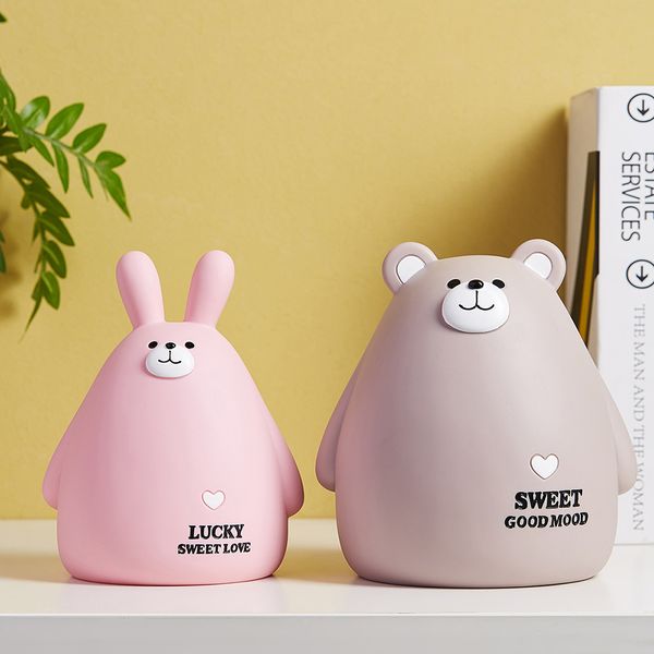 Cartoon piggy bank for saving coins, a cute animal-themed money box that's a practical and modern home decor piece, perfect as a kid's gift