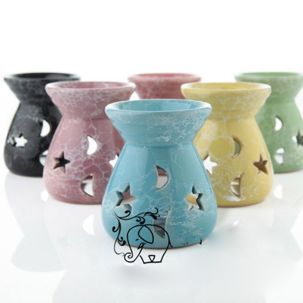 Ceramic essential oil lamps featuring hollow star and moon designs, simple yet elegant for burning fragrance candles and incense