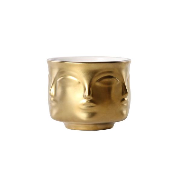 Ceramic vase with floral face design for modern cactus and succulent planters in white, black, and gold