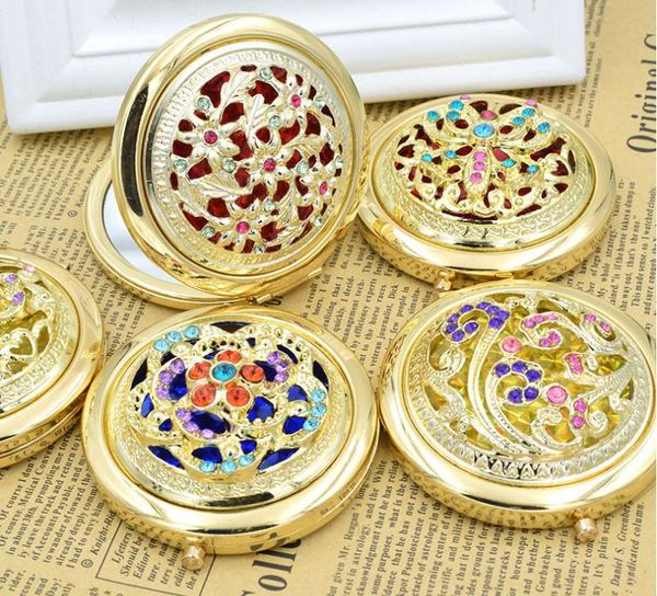 Chic retro gold metal pocket mirror with crystal accents, a portable vintage cosmetic compact for gifts