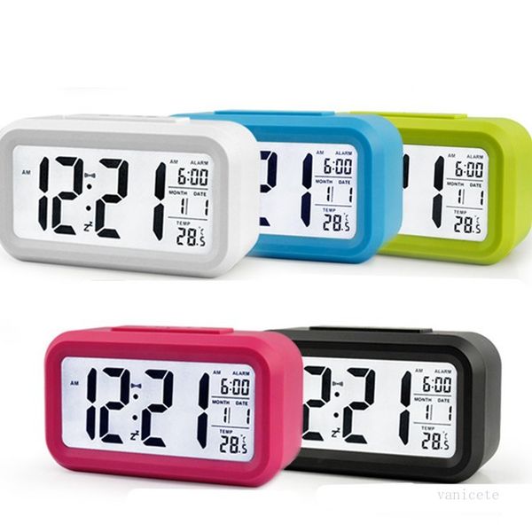 Compact digital alarm clock with smart sensor nightlight, temperature display, silent operation, and snooze function for bedside use