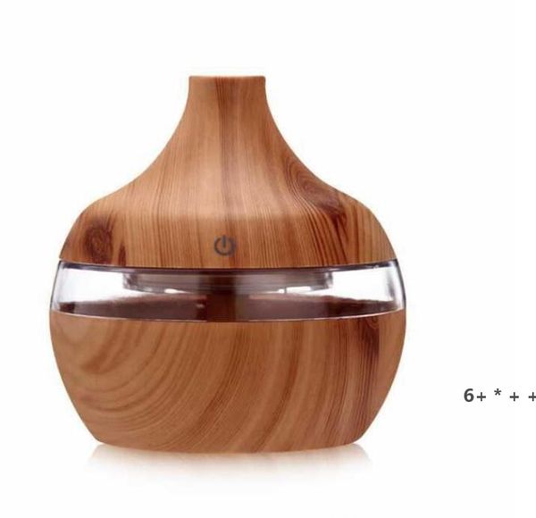 Compact USB-powered air humidifier with wood grain design, featuring ultrasonic aromatherapy for essential oils