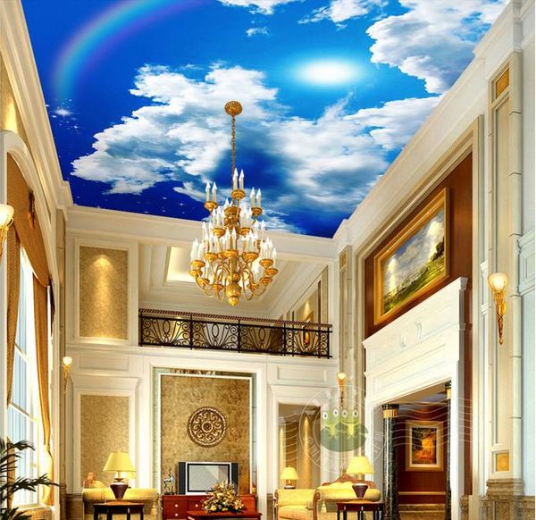 Custom 3D sky ceiling wallpaper featuring blue sky, white clouds, sun, and rainbow for living room decor