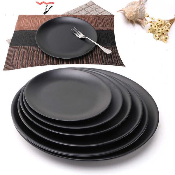 Decorative black melamine round trays for serving sushi, steak, desserts, and snacks at dinner or tea