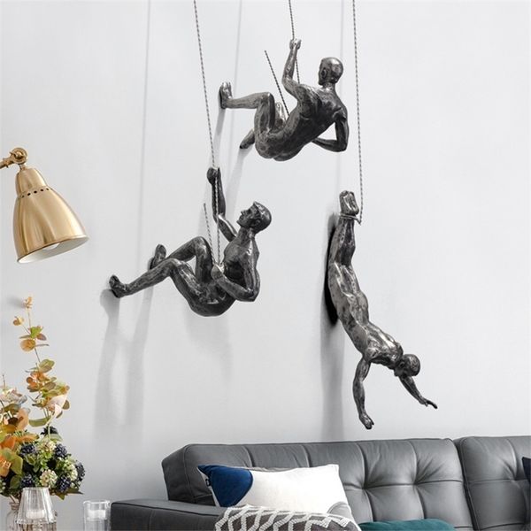 Decorative resin sculpture of a rock climbing man for wall hanging