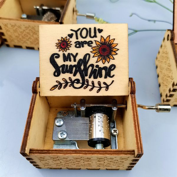 Decorative wooden music box with carved and printed designs, a lovely holiday gift for your wife, daughter, or son this Christmas season