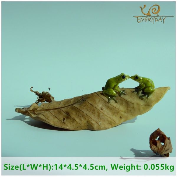 Frog figurine on a leaf, perfect for garden decoration or toy collection
