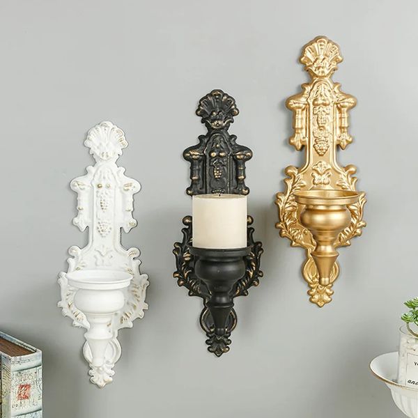 Gold wall-mounted tealight candle holder in rustic black metal with pre-drilled holes for easy installation