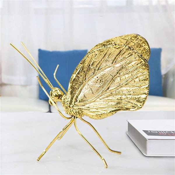 Golden butterfly figurines for living room decor, crafted from metal