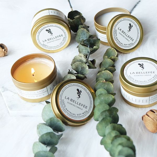 Golden tin can scented candles with soy wax and essential oils, perfect for gifting and wholesale