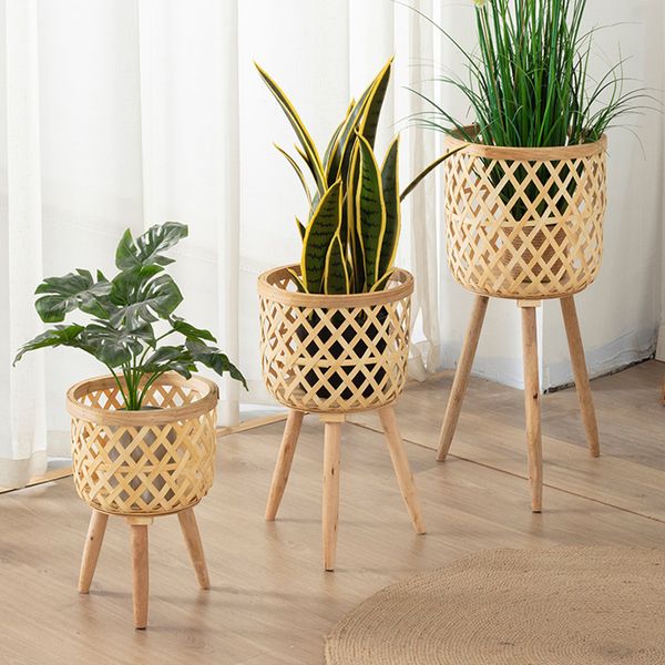 Handmade bamboo woven flower pot with stand for plant display and storage, ideal for DIY home decor and nursery use