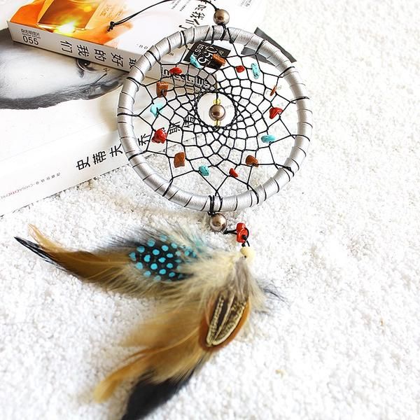 Handmade dreamcatcher with feathers, a mystical forest-inspired wall or car ornament for decoration