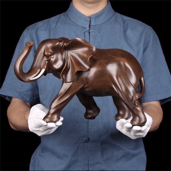 Miniature resin elephant figurine for home decor, perfect as a Feng Shui ornament in living rooms or offices