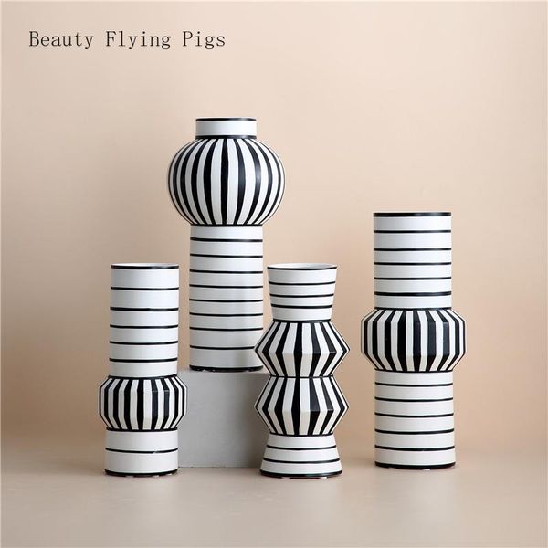 Modern black and white striped ceramic vases for artistic flower arrangements, perfect for living room TV cabinets or home hydroponic plant decor