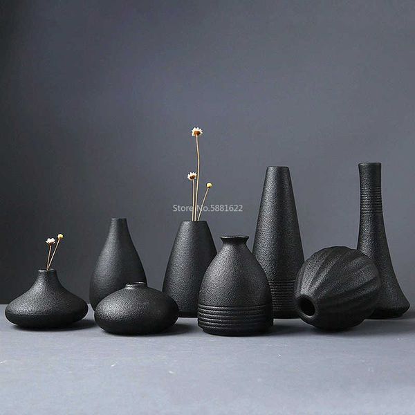 Modern black ceramic small vase for stylish floral arrangements and home decor