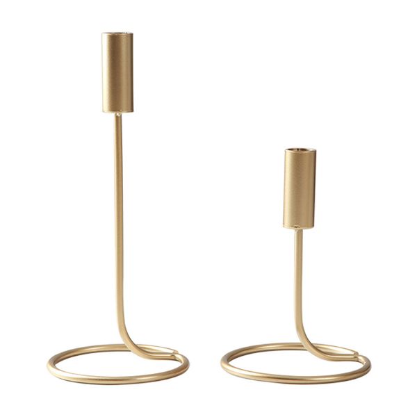 Modern gold and black wrought iron taper candle holder with circular base, ideal for wedding table centerpieces