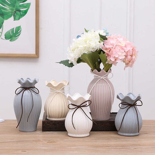 Modern white and blue porcelain vase for wedding centerpieces, crafts, and home decor with dry flowers