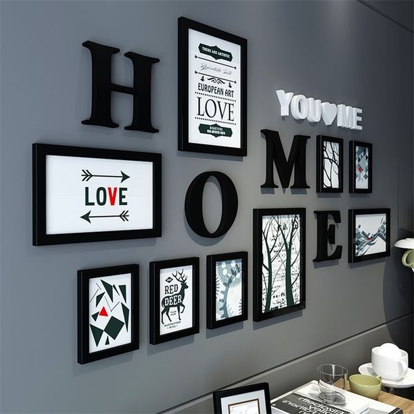 Nordic-inspired black and white photo frame set with mixed letter elements for stylish wall decor