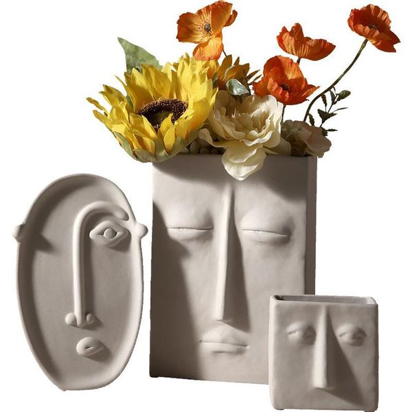 Nordic-inspired ceramic vase with human face design, perfect for dried or fresh floral arrangements