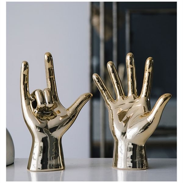 Nordic-inspired gold-plated ceramic sculpture with abstract hand gestures, perfect for home decor