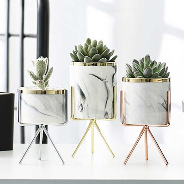 Nordic-style ceramic vase with marble design in rose gold and silver, perfect for plants or decor in home or office settings