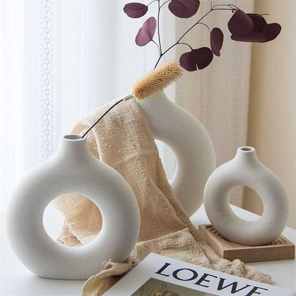 Nordic-style hollow ceramic vases, perfect for donut-shaped flower pots, enhance home and office decor with elegant interior accents