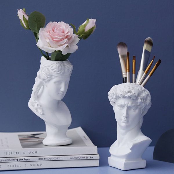 Nordic-style resin vase featuring a human head design, perfect for holding flowers, pens, or brushes, ideal for home and garden decoration