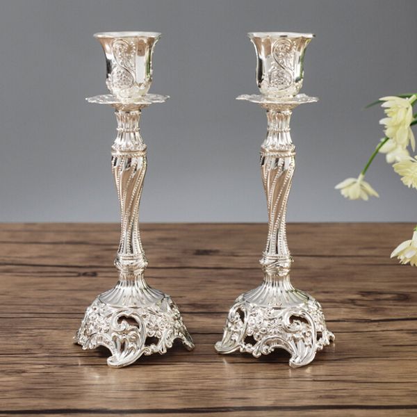 Pair of antique European metal candle stands in gold and silver for home decor