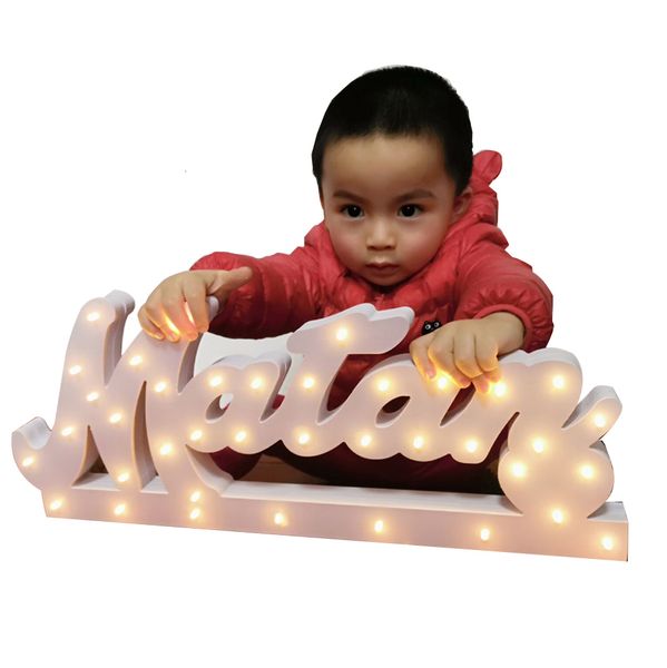 Personalized wooden baby name sign for nursery decor, custom-cut and finished in your choice of wood and font from 2211 options