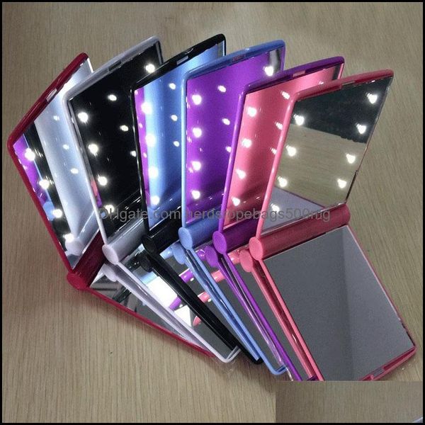 Portable folding LED makeup mirror with lights for women and girls, ideal for travel and cosmetic use