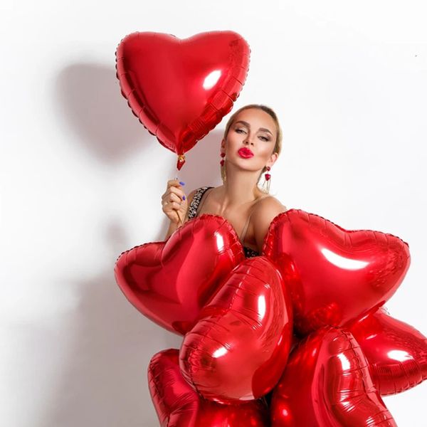 Red heart-shaped inflatable foil balloons for Valentine's Day, weddings, birthdays, and anniversaries in sizes 5, 10, 18, and 36 inches