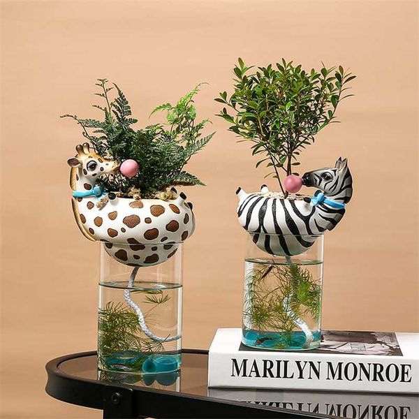 Resin animal head vase featuring a fish tank bubble design with natural cactus and succulent plants, ideal for creative zebra and giraffe-themed floral decor