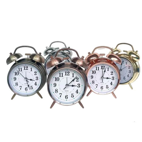 Retro gold wind-up alarm clock with vintage design, metal case and snooze function for home decor
