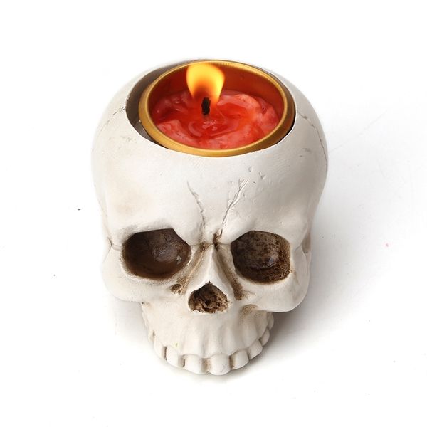 Small silicone mold for crafting concrete resin pots, ashtrays, and candle holders with a skull head design