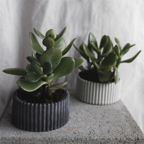 Striped candle molds for small round concrete flower pots and containers