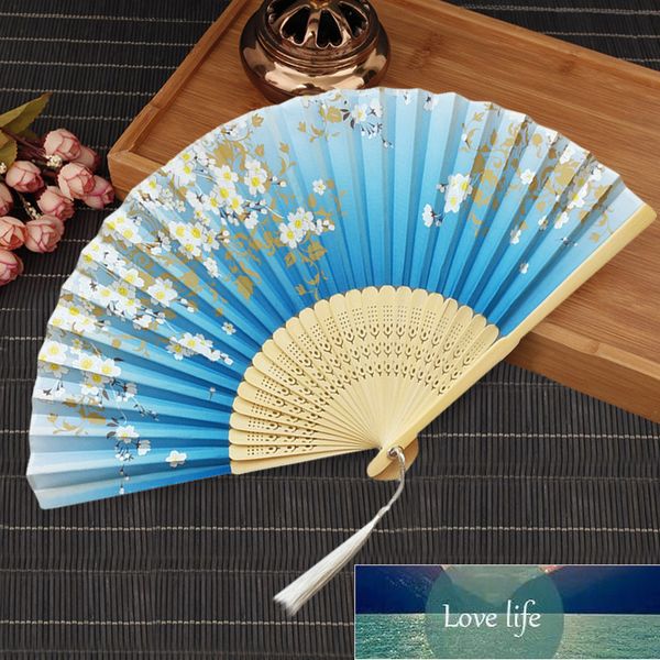 Vintage-inspired silk folding fan featuring Chinese and Japanese designs, perfect as an artistic gift or elegant home decor
