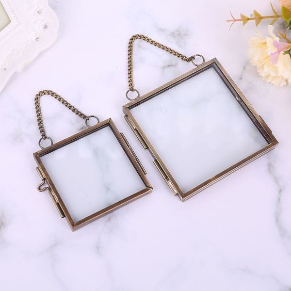 Vintage-style metal photo frame with clear glass for showcasing botanical specimens like pressed flowers and plants