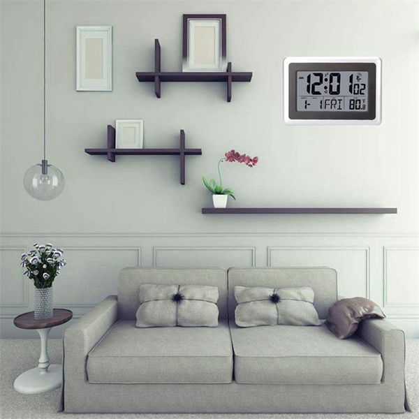 Wall-mounted atomic digital clock with large LCD display, battery-powered, shows indoor temperature and calendar, tabletop or standing design, includes snooze function