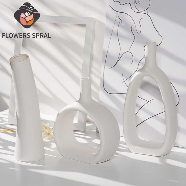 White ceramic geometric hollow Nordic vase for stylish home and dining decor, a creative gift idea