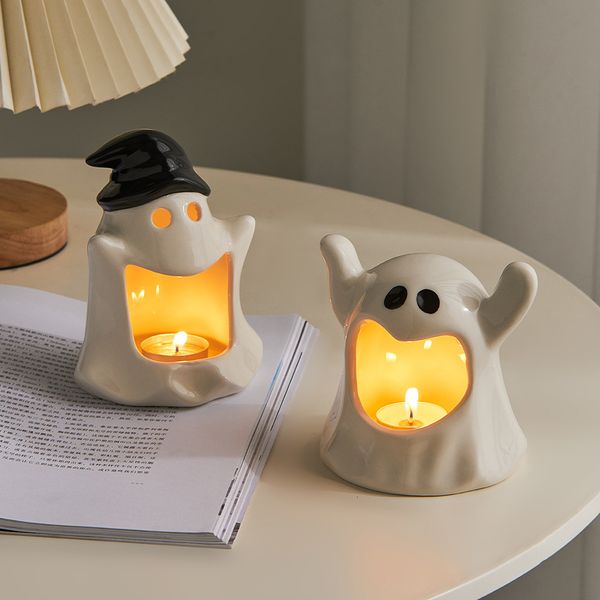White ceramic ghost-shaped candle holder for fairy gardens, home decor, or office spaces, perfect for holding cute wax candles