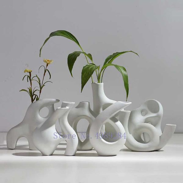 White ceramic vase for modern home decor with abstract flower arrangement