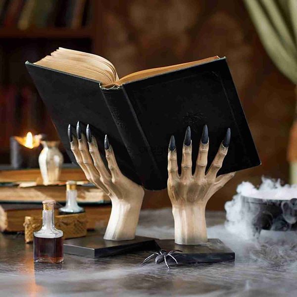 Witchy hand-shaped bookstand for contemporary home decor, a Halloween-themed resin sculpture and shelf ornament